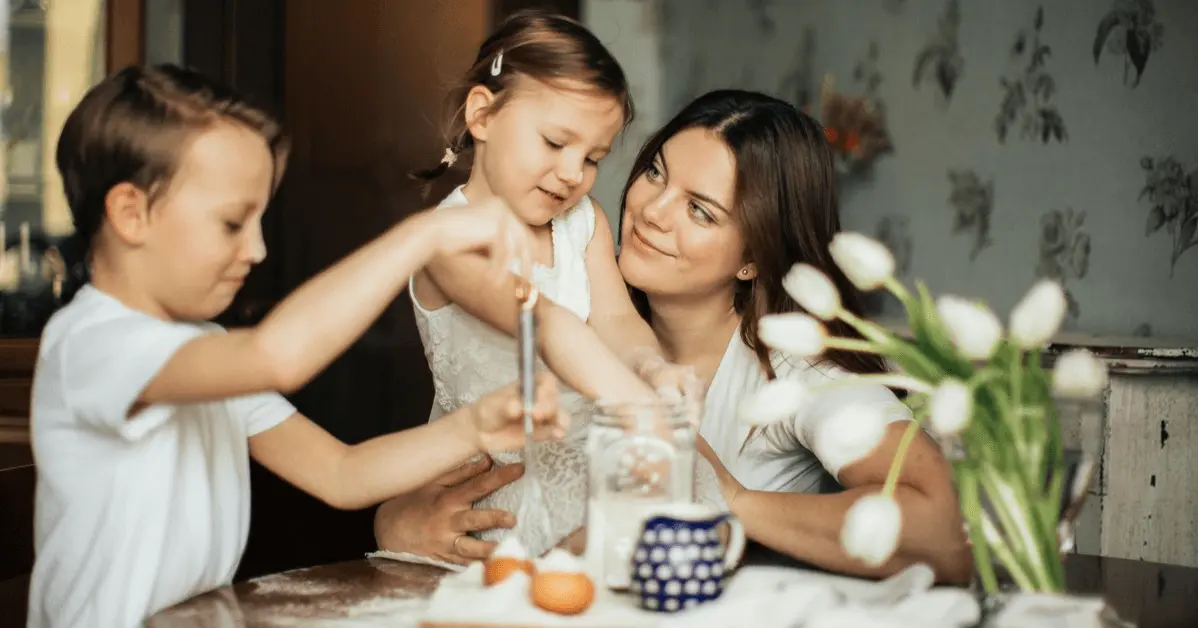 Mother spending quality time with her two young children in a cozy home setting